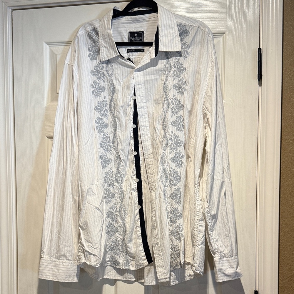 Button up shirt with grey pinstripes and silver design on the front.